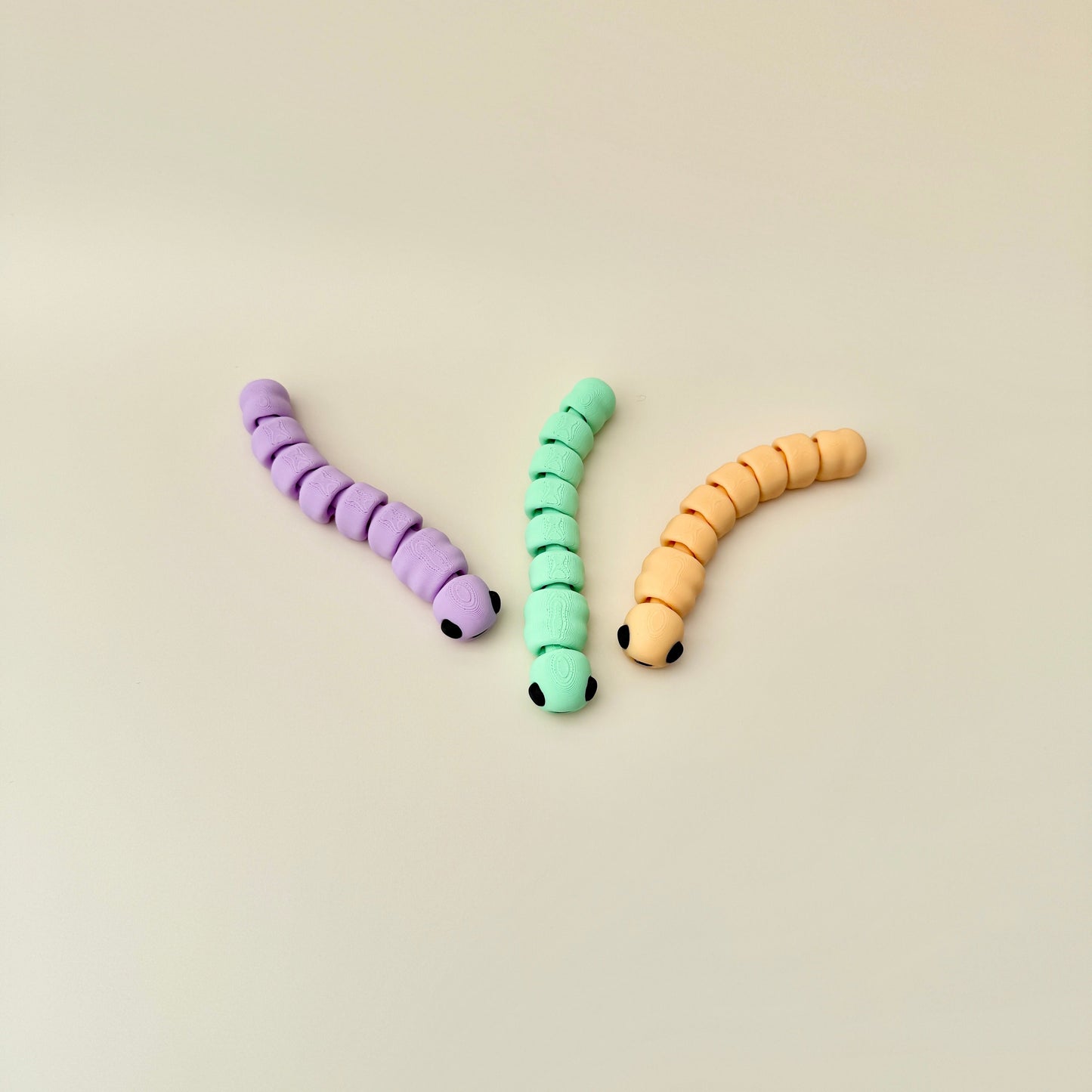 Flexible worm fidget toy with a fully articulated body, ideal for stress relief and focus.