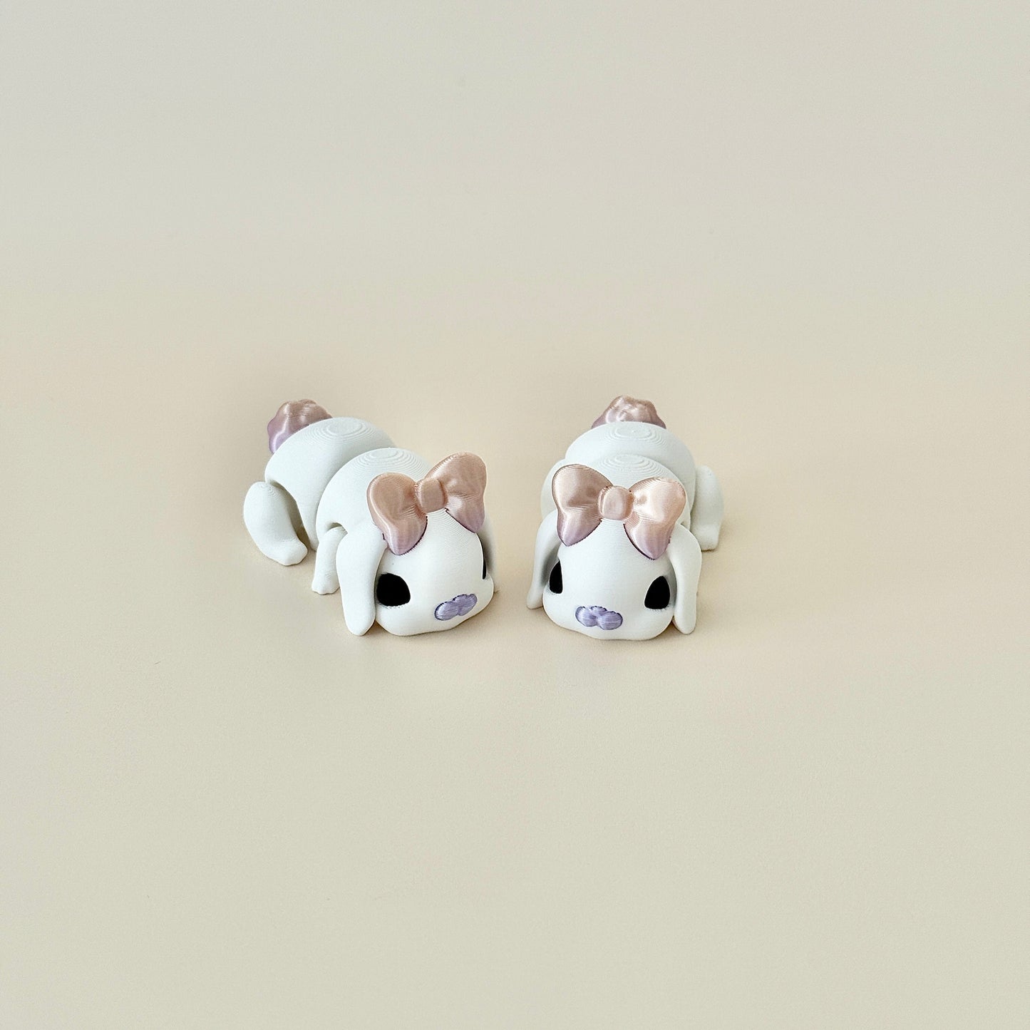 Adorable white bunny fidget toy, 6cm in length, featuring black eyes and iridescent details.