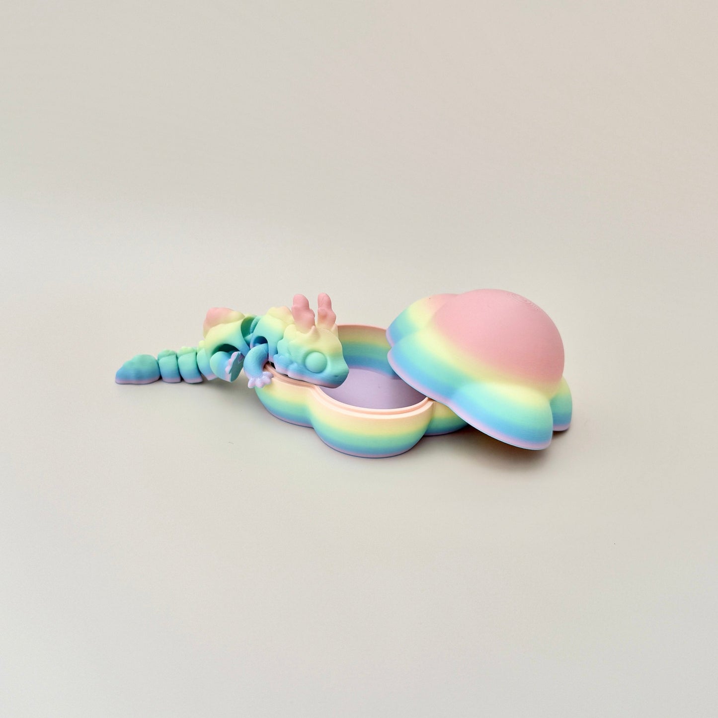 Detailed pastel Cloud Dragon with movable body, horns, and claws, designed for sensory play.