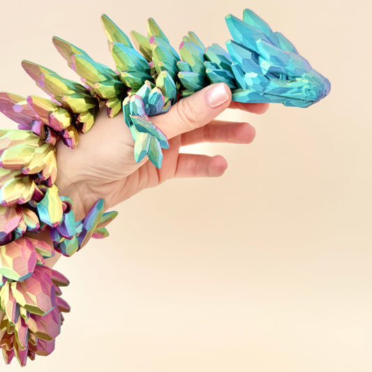 Fully flexible Crystalborne Dragon in red, blue, and gold colour-changing design, 64cm in length.