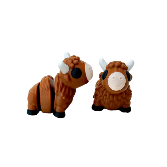 Bison fidget toy with brown furry finish, white horns, black eyes and hooves, and nude mouth, 5cm in size.