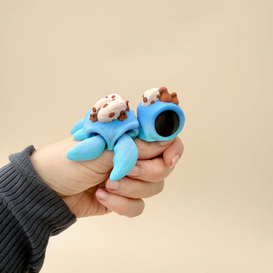 Fidget toy with a blue gradient body and cookie details, perfect for sensory play.