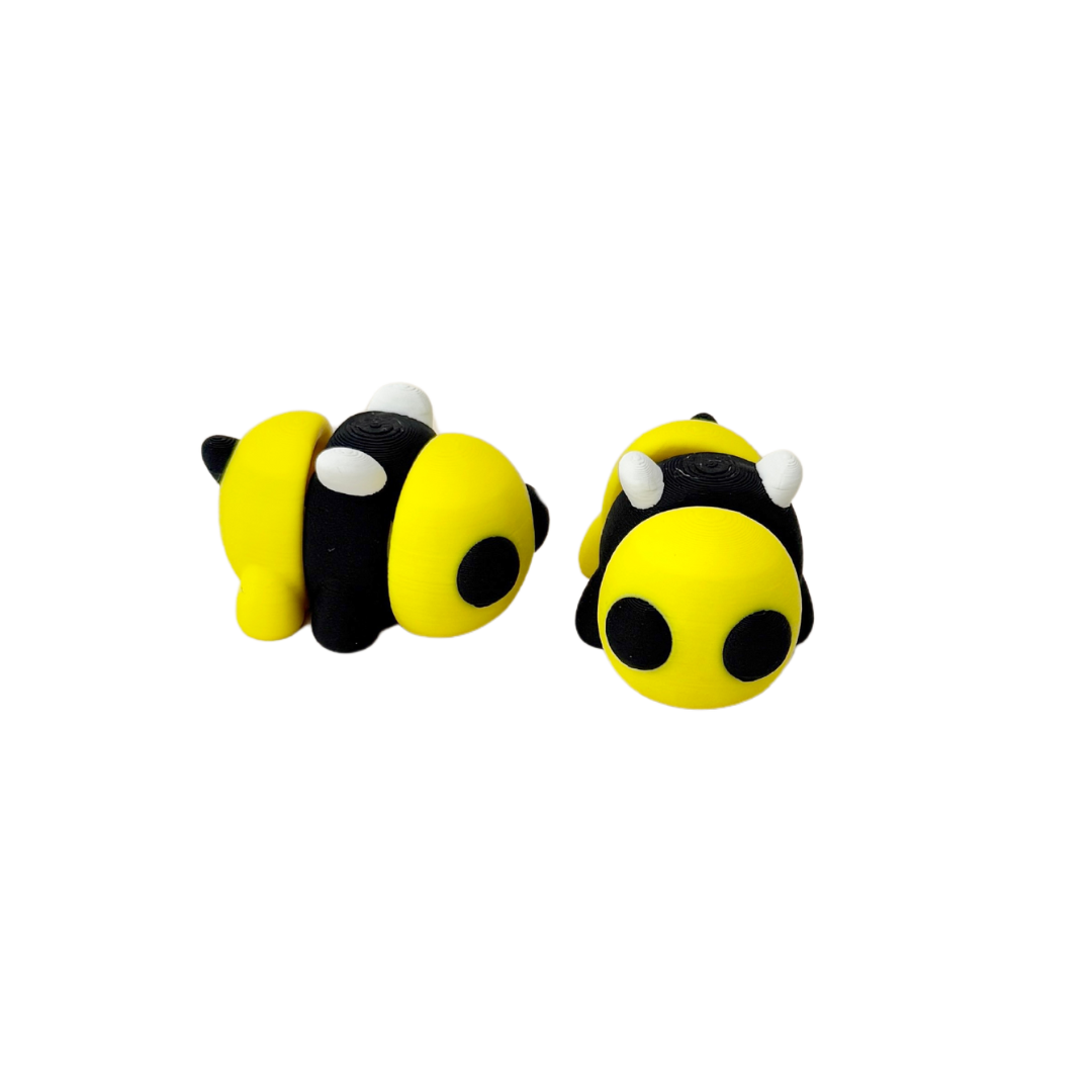 Yellow and black bumble bee fidget toy with white wings, fully articulated for sensory play.