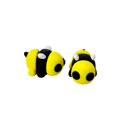 Yellow and black bumble bee fidget toy with white wings, fully articulated for sensory play.