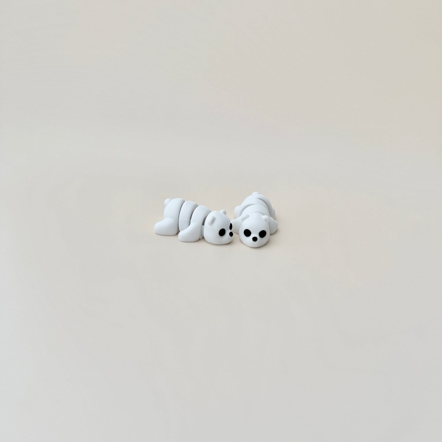 Cute polar bear fidget toy, all-white with black eyes and nose, ideal for festive fidgeting.