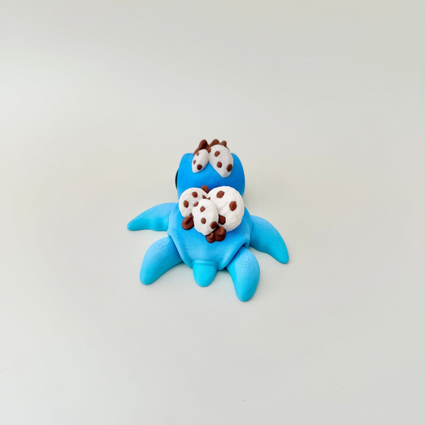 9cm cookie turtle fidget toy with adorable black eyes and intricate detailing on its body.