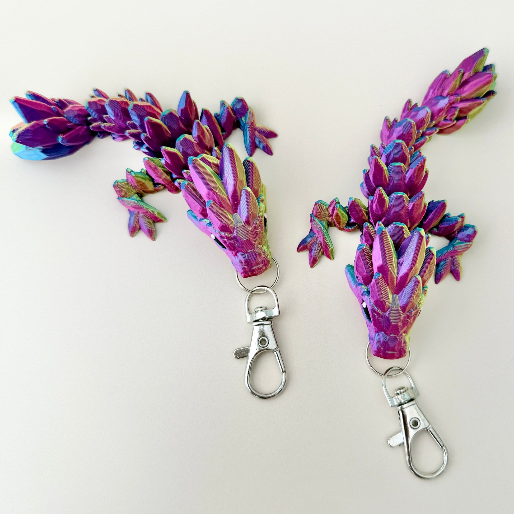 Keyring dragon in dynamic colours of gold, blue, and red, fully articulated for sensory engagement.