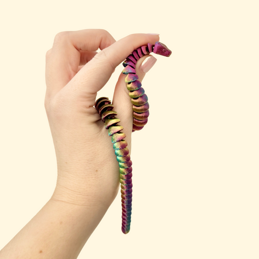 Fully articulated snake fidget toy with a 25cm colour-changing body in blue, green, gold, and purple.