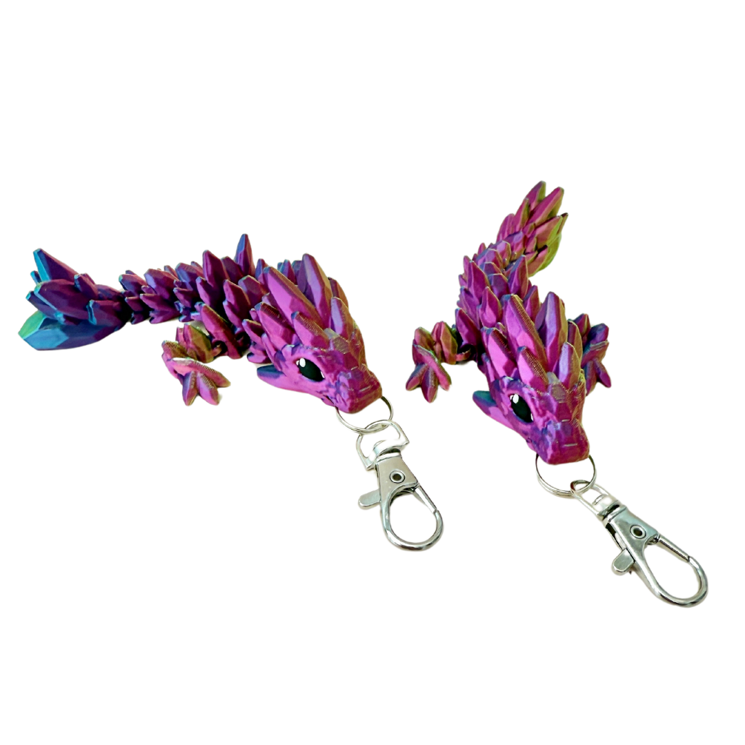 Crystalborne Dragon keyring in colour-changing filament, with shades of gold, blue, and red, 11cm in length.