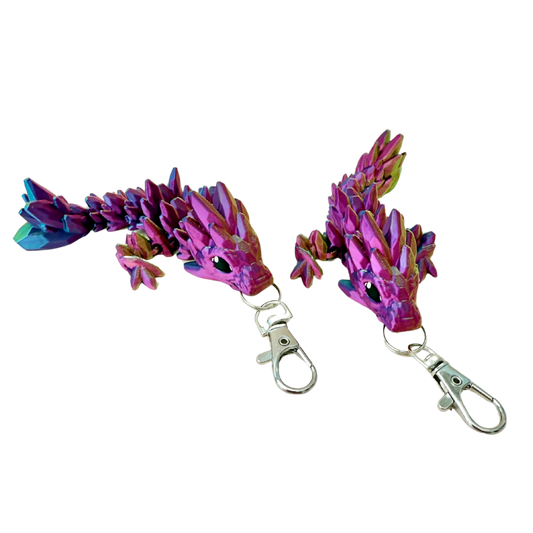 Crystalborne Dragon keyring in colour-changing filament, with shades of gold, blue, and red, 11cm in length.