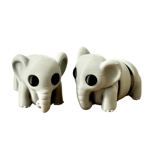 Close-up of a grey elephant fidget toy with black eyes, featuring a movable, articulated body for tactile engagement.