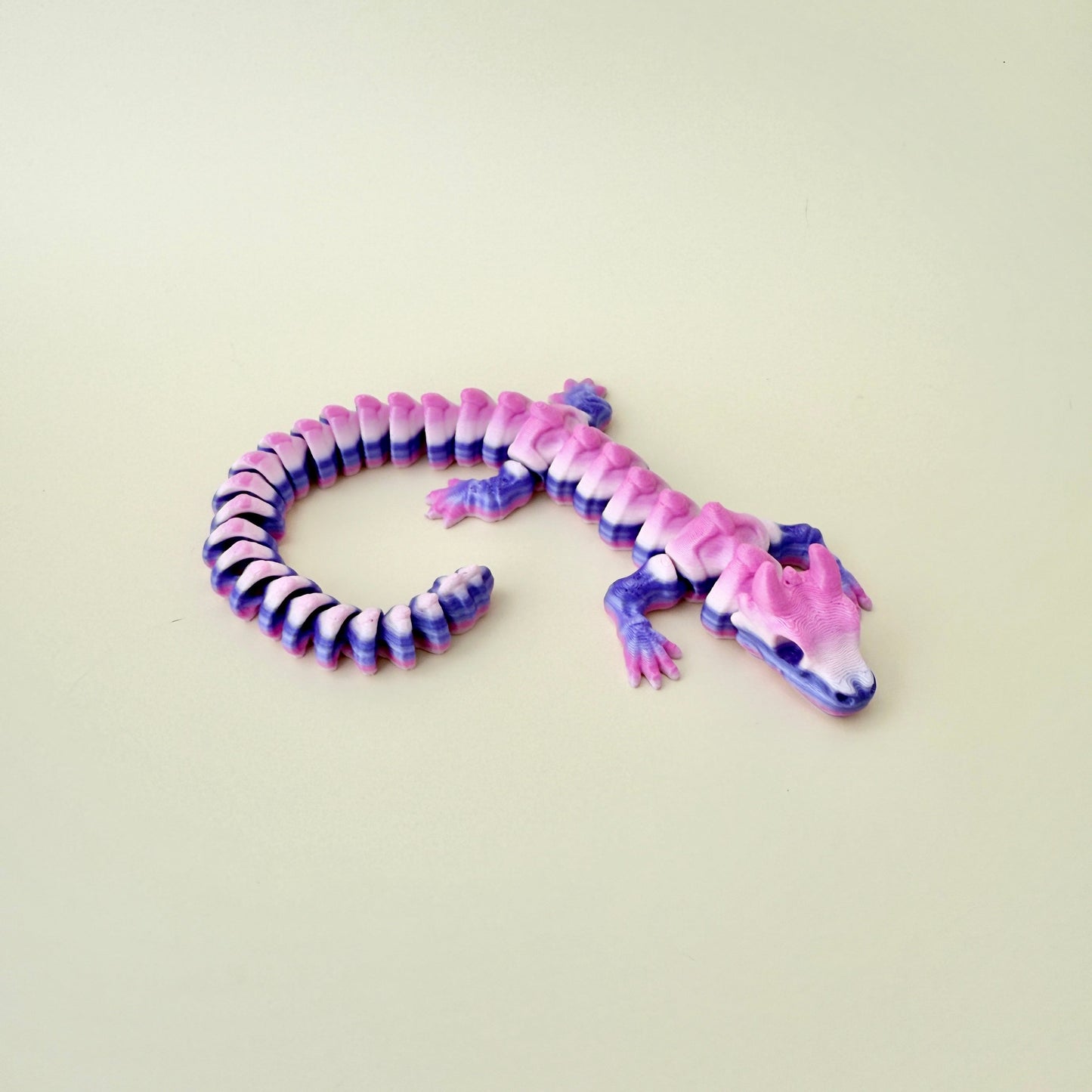 Purple gradient Skeleton Dragon fidget toy with detailed bone features and fluid movement.