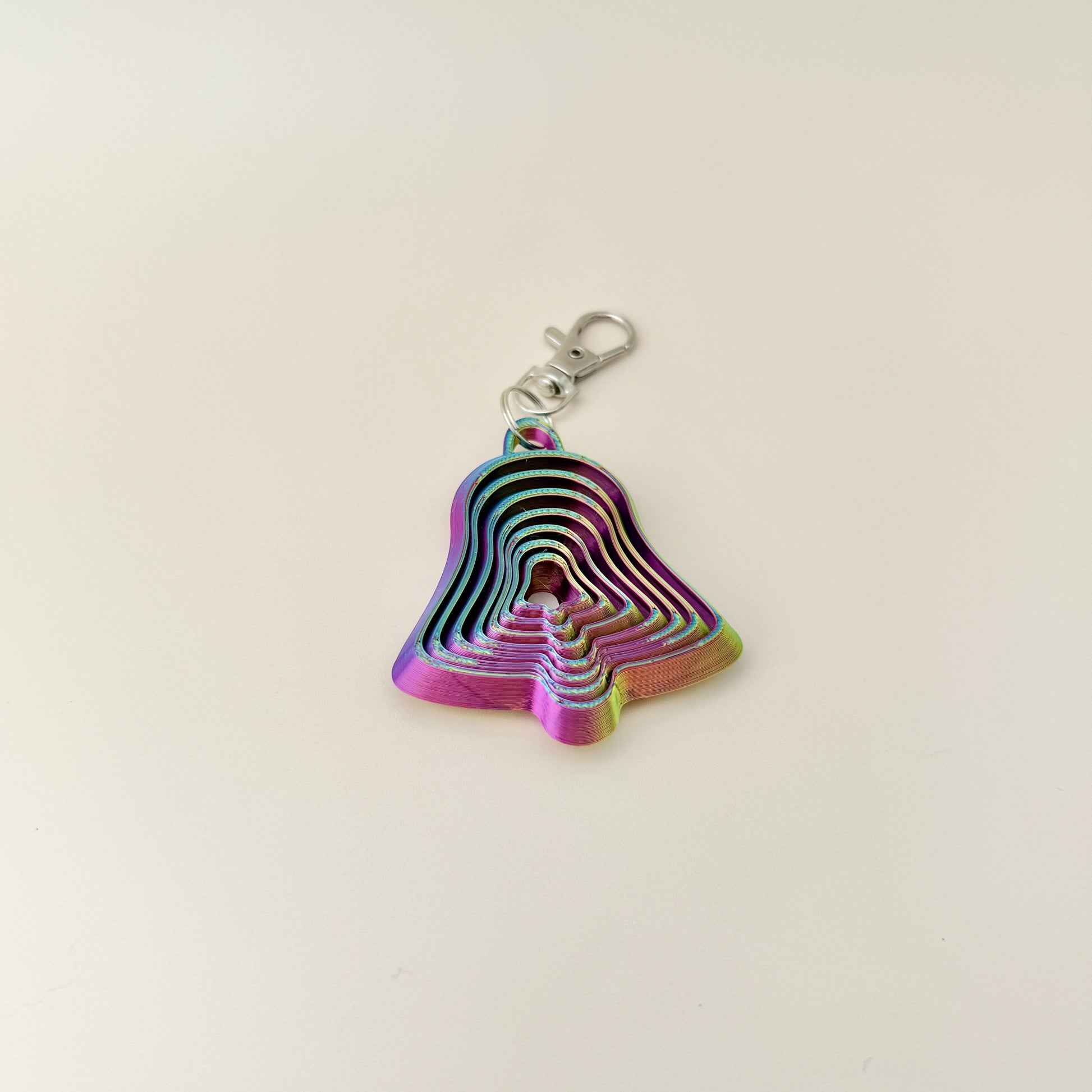 Colour-changing Christmas bell fidget keyring, perfect for sensory play and holiday accessories.