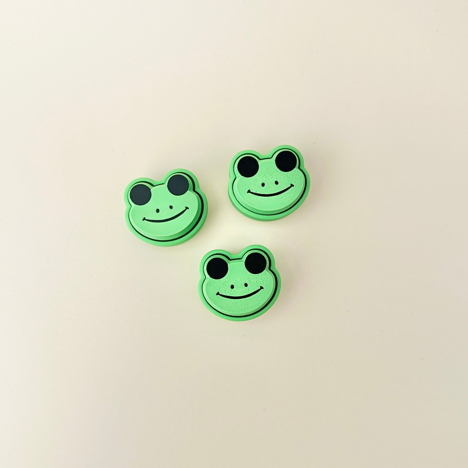 Small green frog fidget toy with a clicking feature, perfect for on-the-go fidgeting and stress relief.