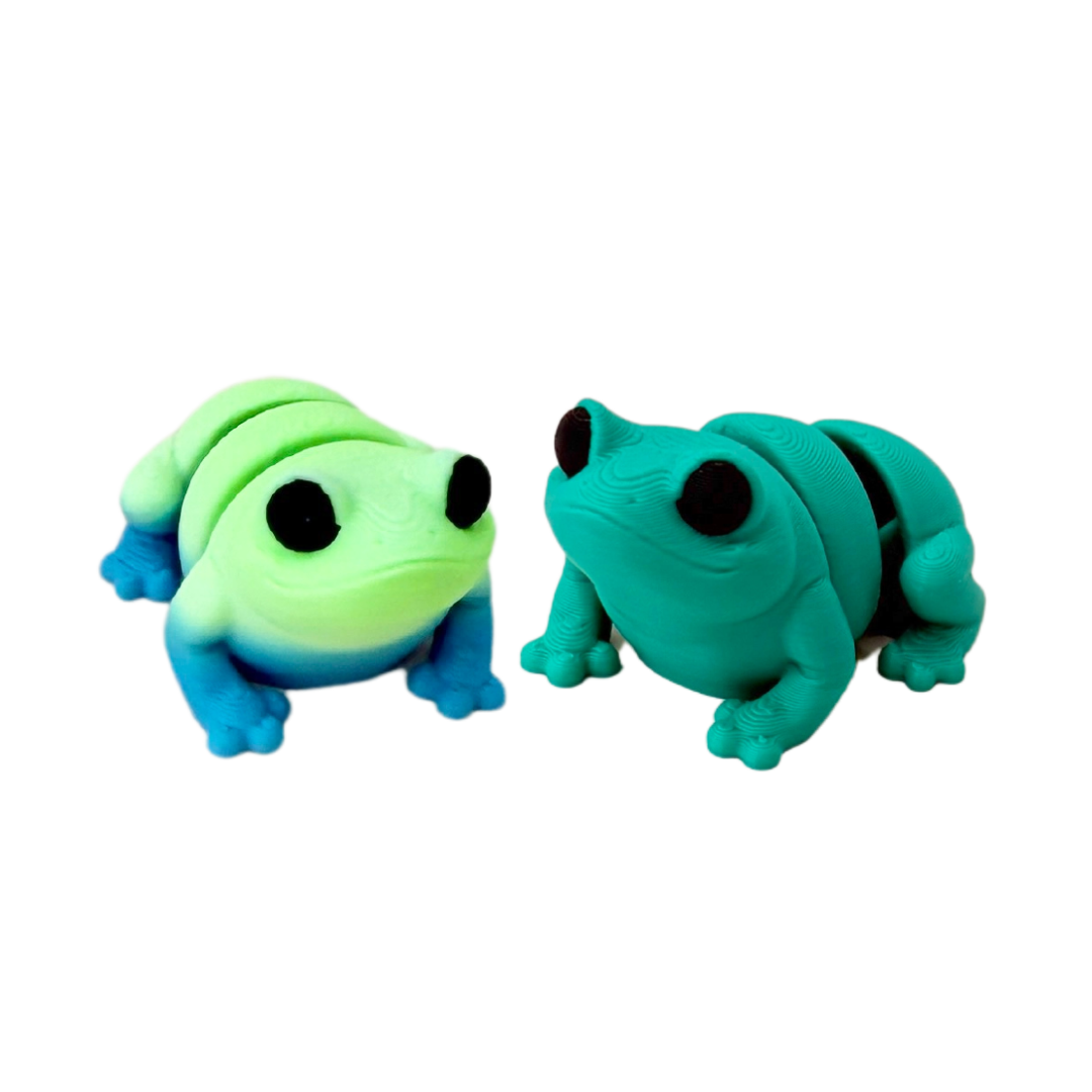 Green frog fidget toy with black eyes, just over 4cm in size, designed for sensory play.