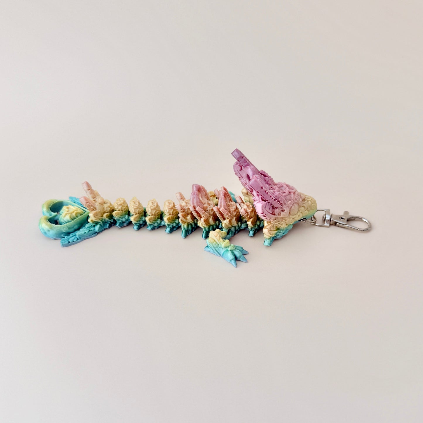 Heart Dragon Tadling keyring with vibrant rainbow finish and heart-inspired details, perfect for keys and bags.