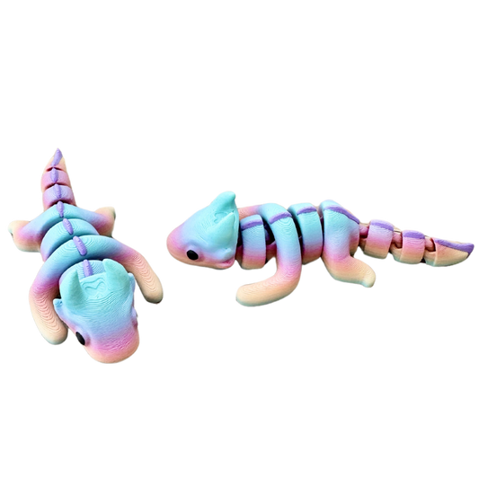 Rainbow axolotl fidget toy with a flexible, fully articulated body and black eyes, perfect for sensory play and stress relief