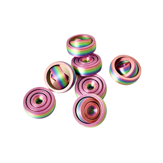 Rainbow fidget spinner with a colourful gradient design, perfect for stress relief and sensory play.