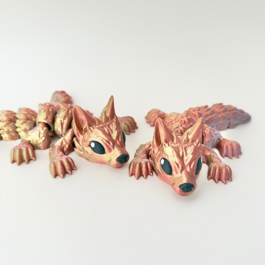 Wolf Pup Dragon fidget with a colour-changing body in gold, silver, and copper, perfect for sensory engagement.