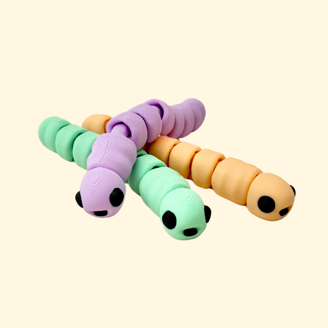 Worm fidget toy, 10cm in length, fully articulated and available in multiple colours, perfect for sensory play.