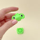 Fun frog-shaped fidget spinner in green, featuring central spinners for easy spinning.