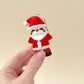 Father Christmas fidget toy keyring in red and white with a moving head and legs, ideal for holiday fun.